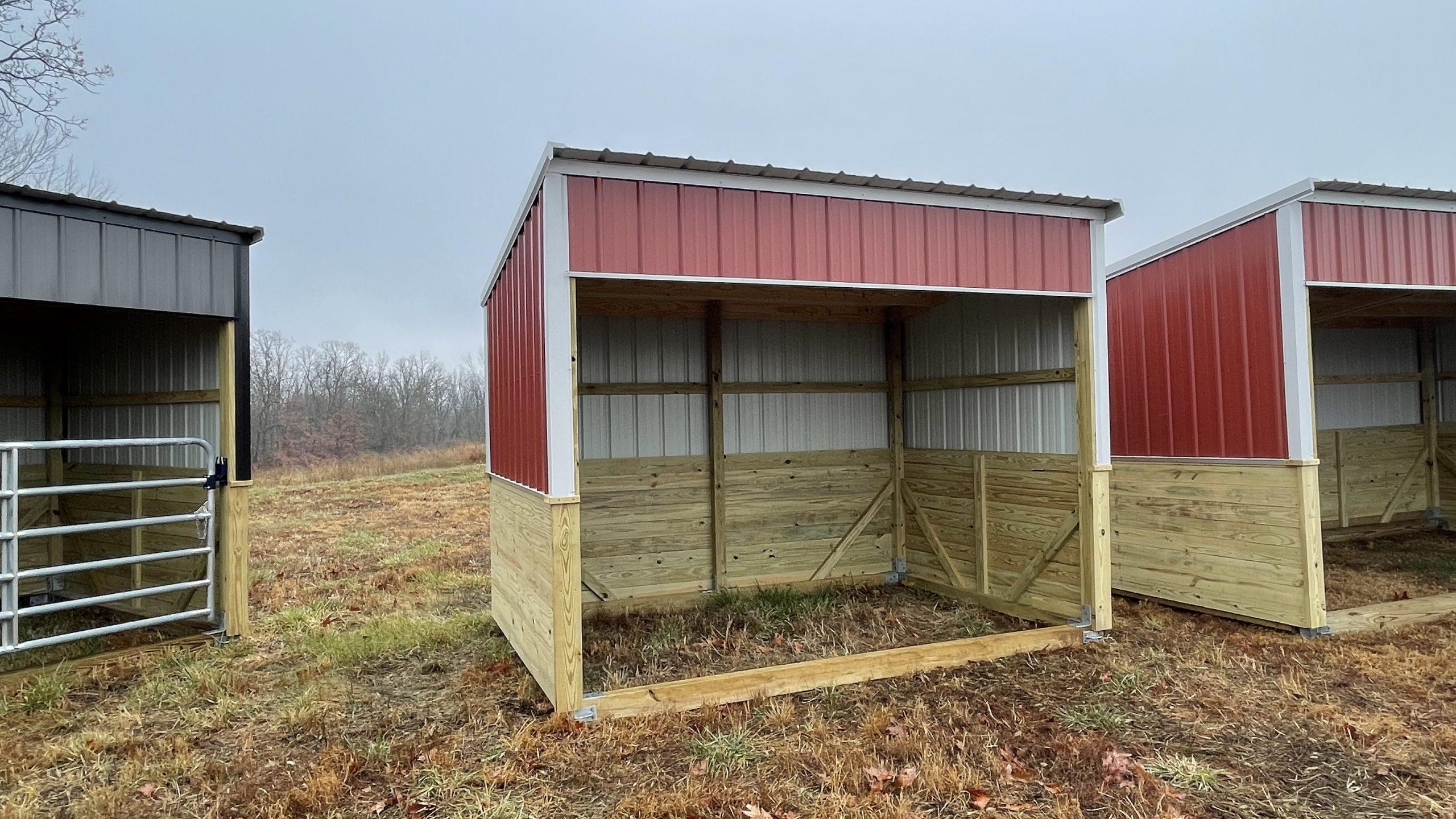 Red Animal Shelter with metal roof, siding, and open front run in with white trim