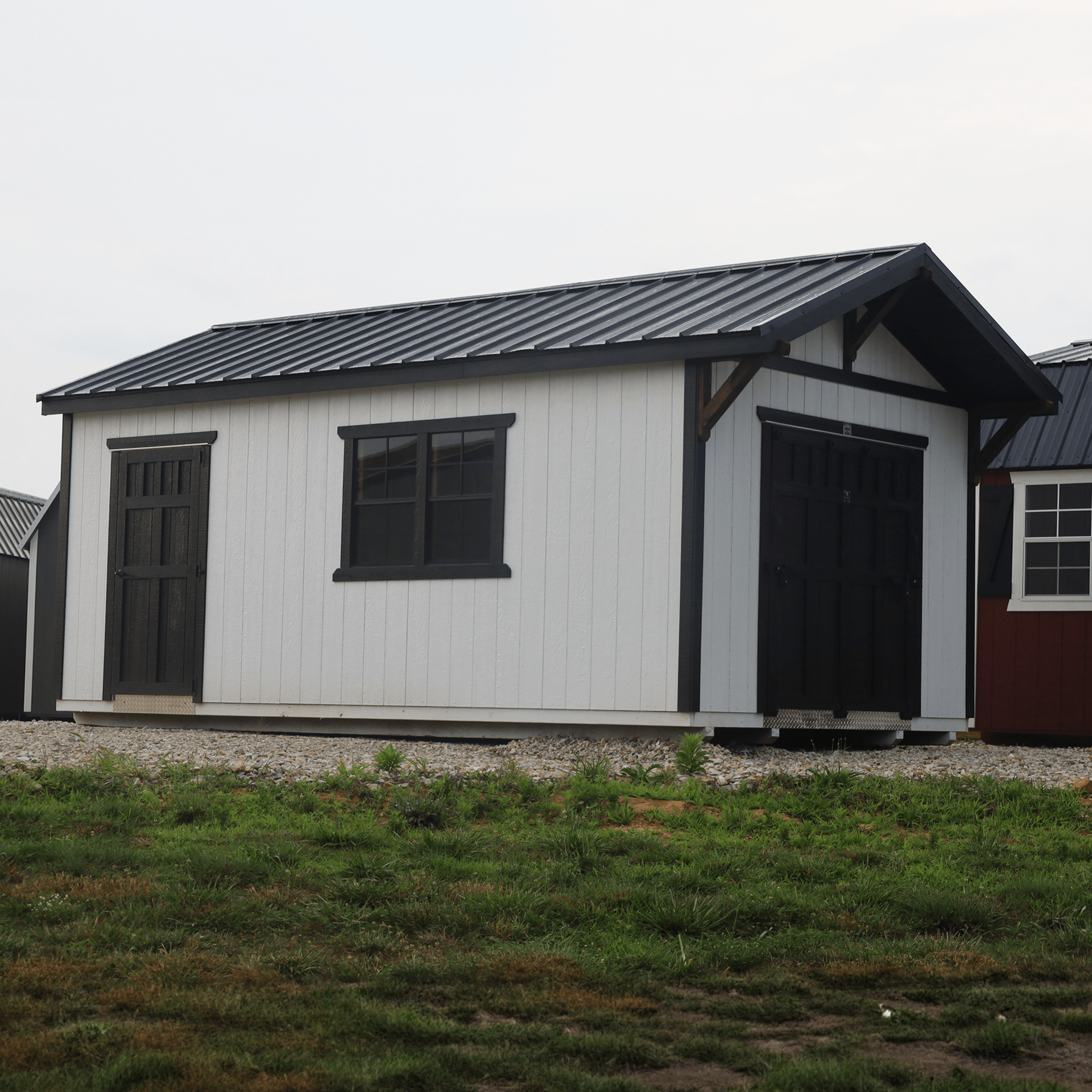 White lofted garage with black trim